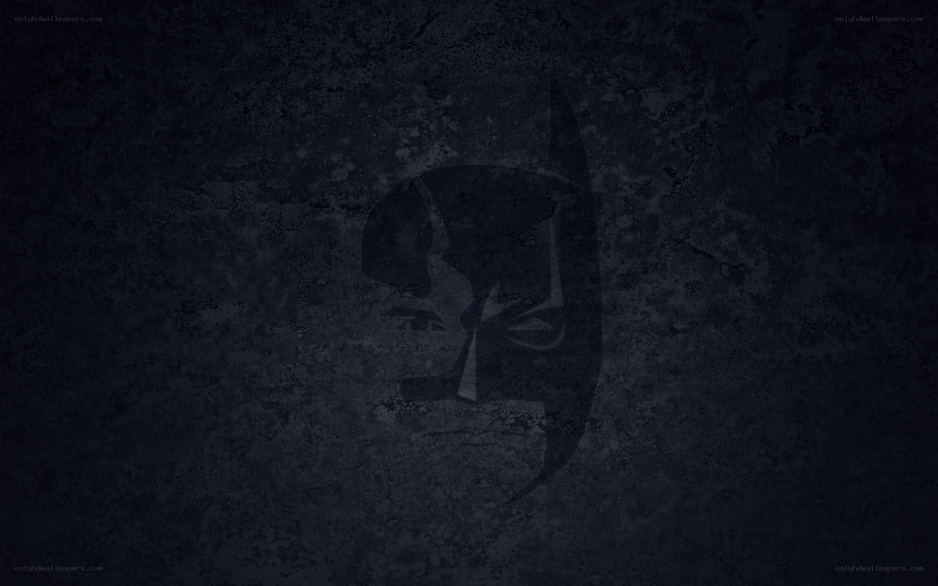 Batman logo on dark wall