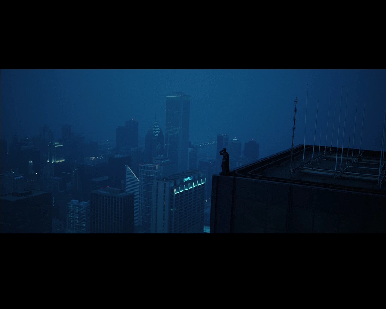 Batman on a city rooftop