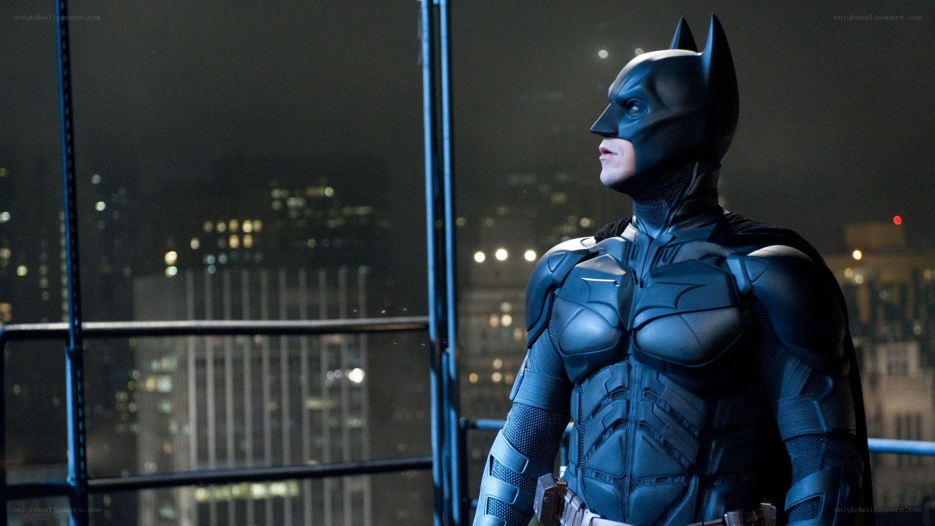 Batman on a rooftop at night