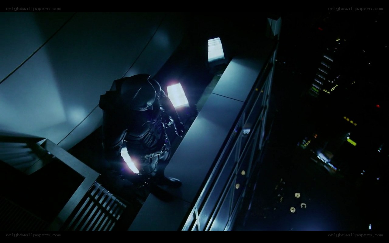 Batman on a rooftop at night