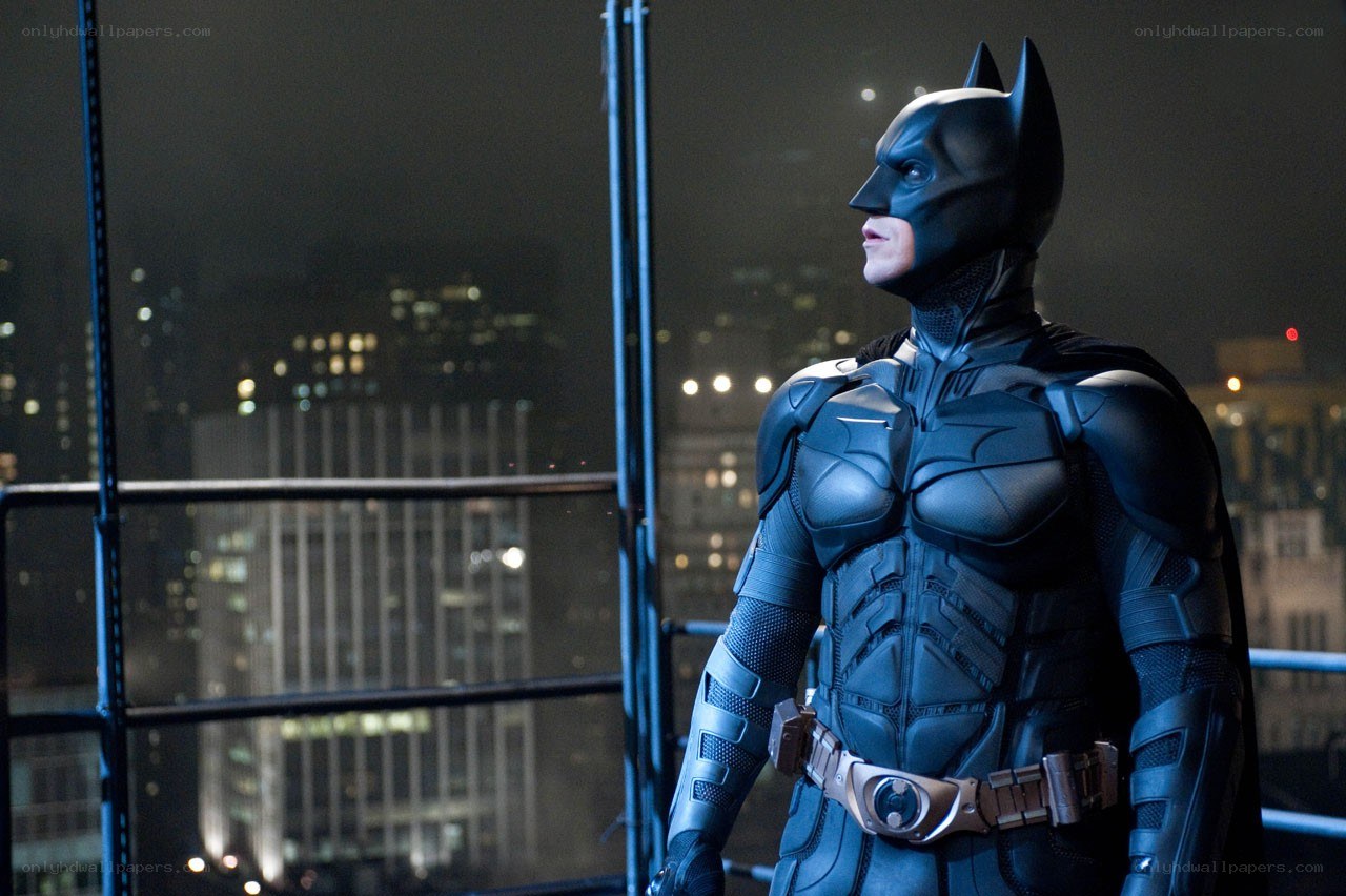 Batman on a rooftop at night