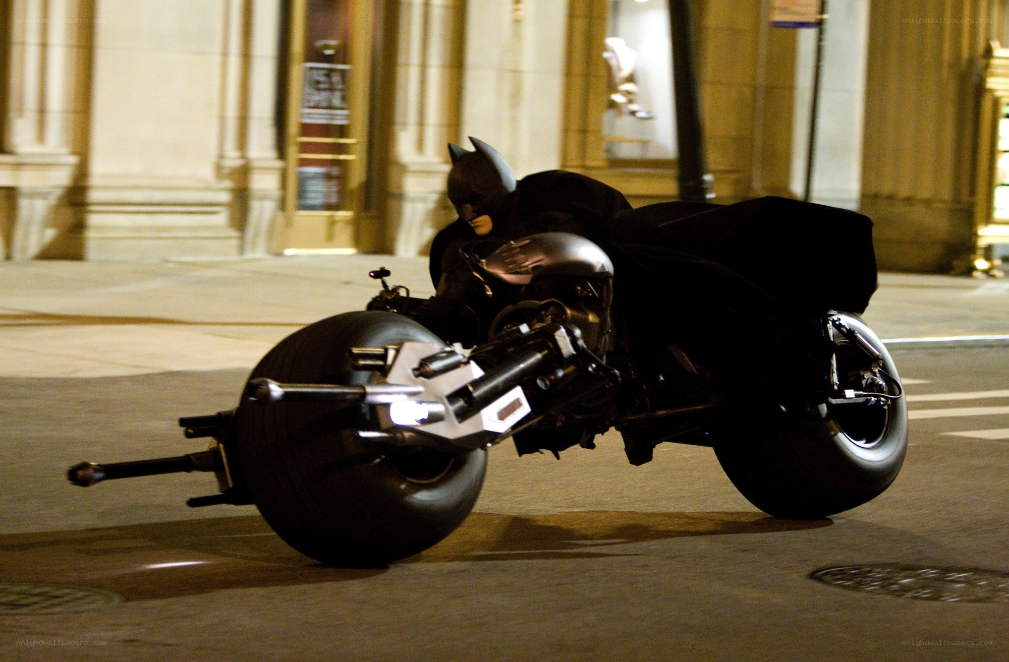 Batman on Batpod at night