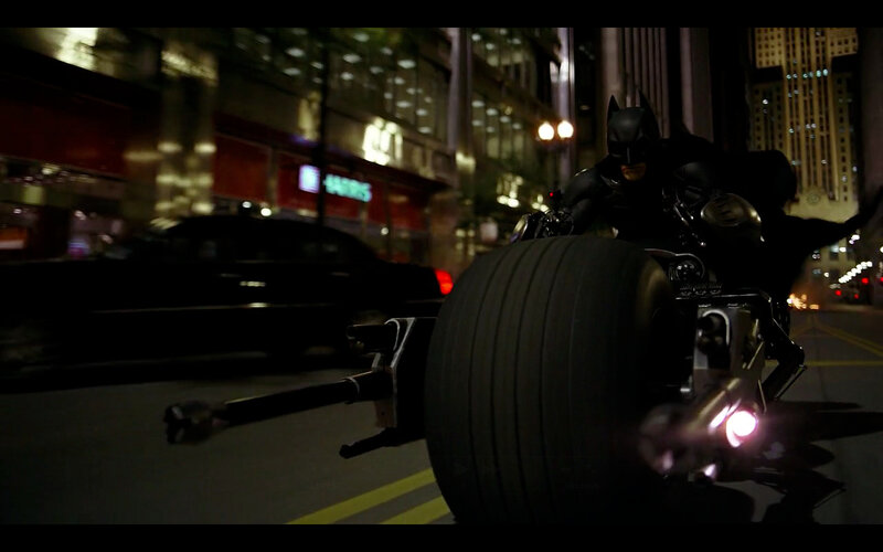 Batman on Batpod at night