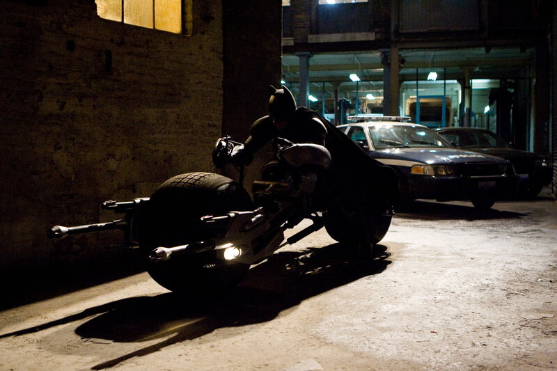 Batman on Batpod in alley