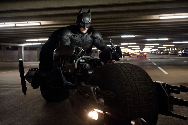 Batman on Batpod in parking garage
