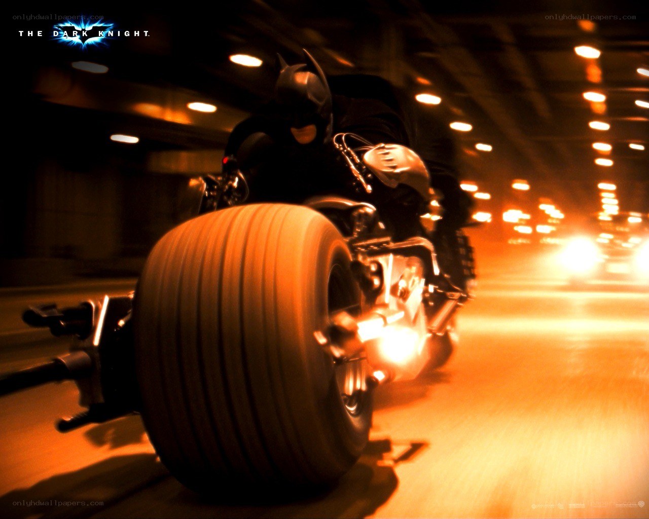 Batman on Batpod in tunnel