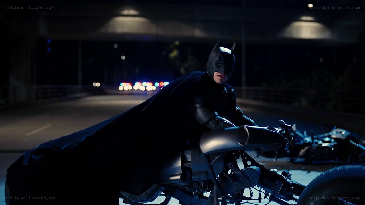 Batman on motorcycle at night
