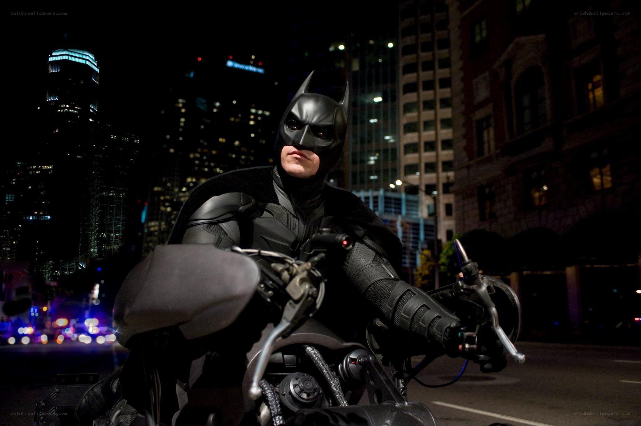 Batman on motorcycle at night