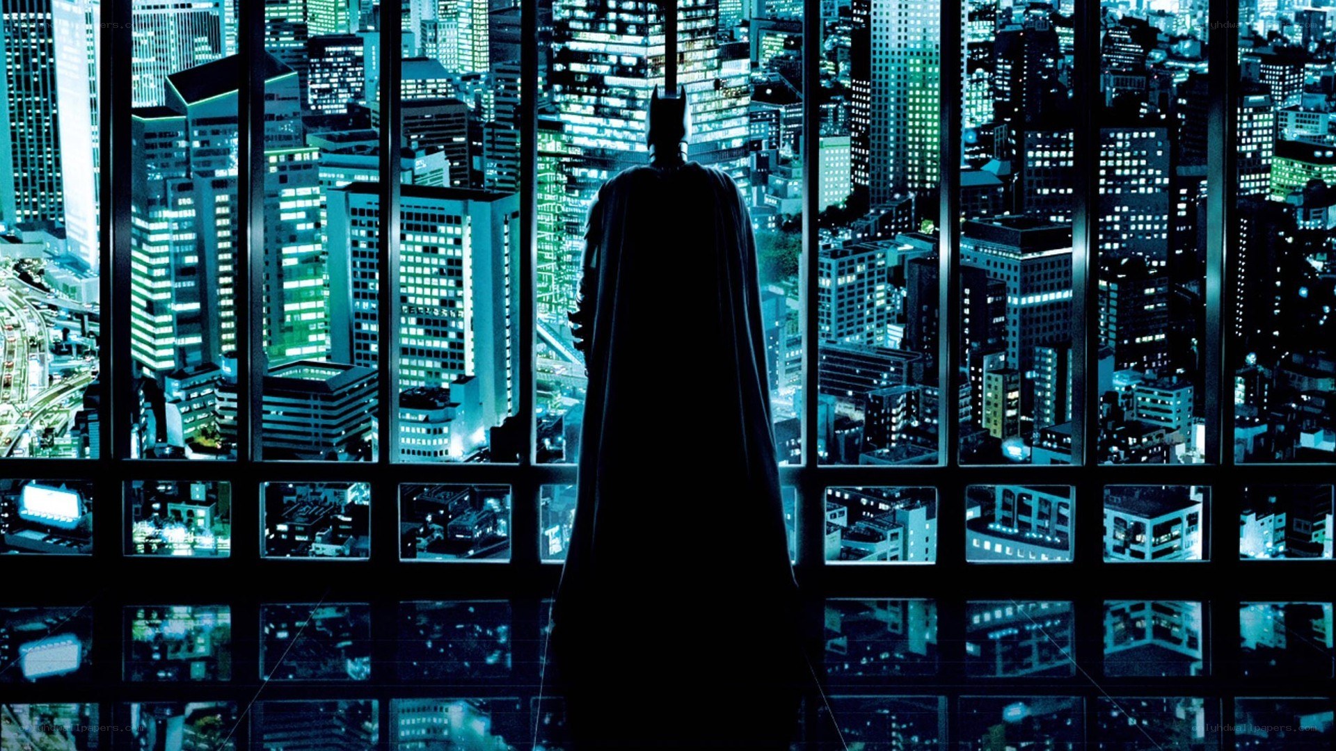Batman overlooking city at night