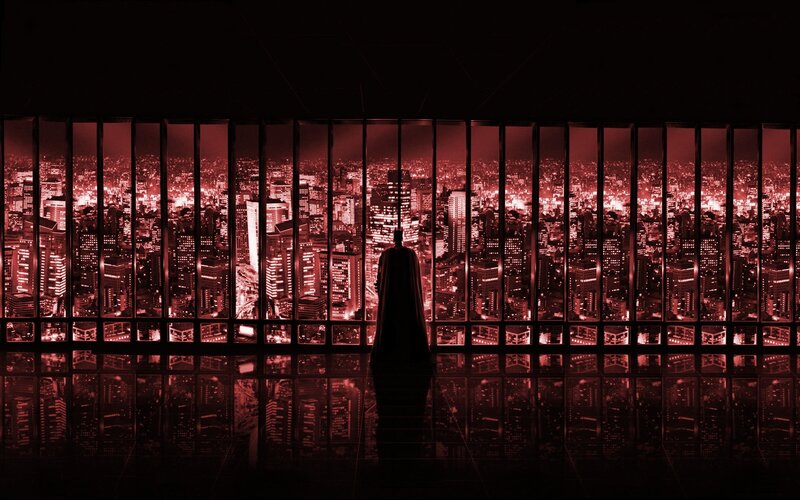 Batman overlooking city at night