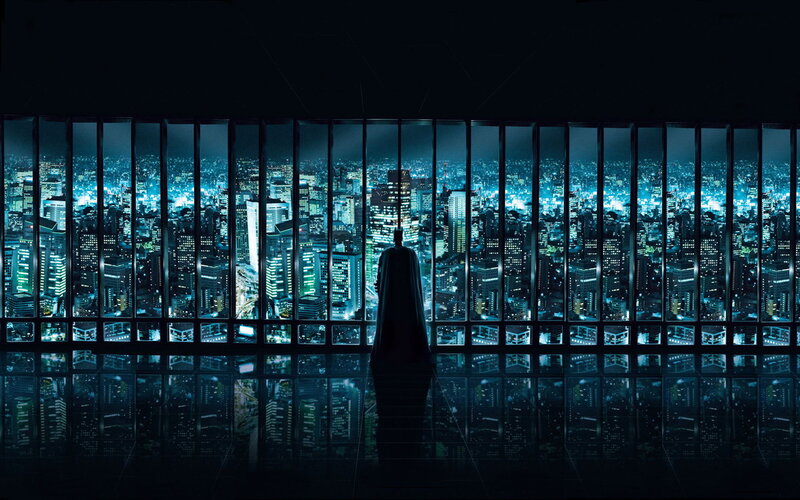 Batman overlooks city at night