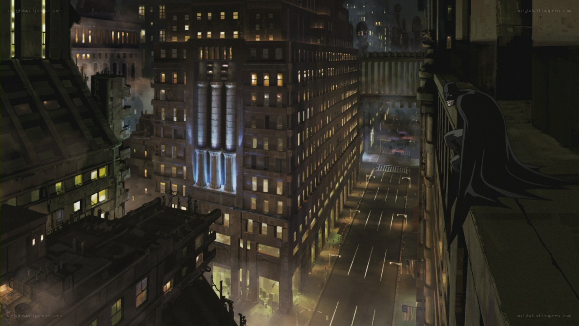 Batman overlooks Gotham at night