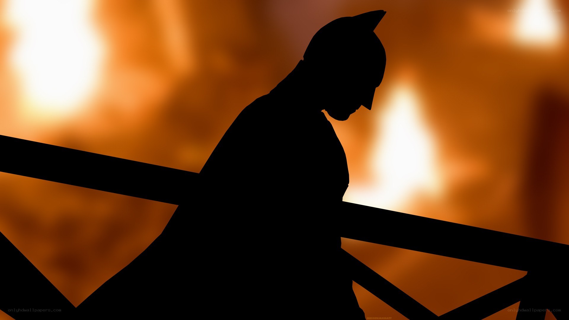Batman silhouette against fire