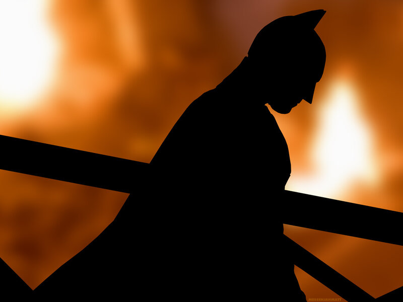 Batman silhouette against fire