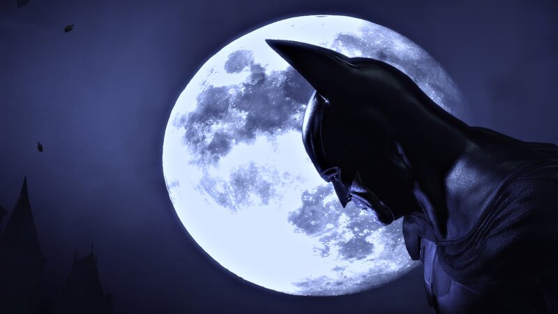 Batman silhouetted against moon