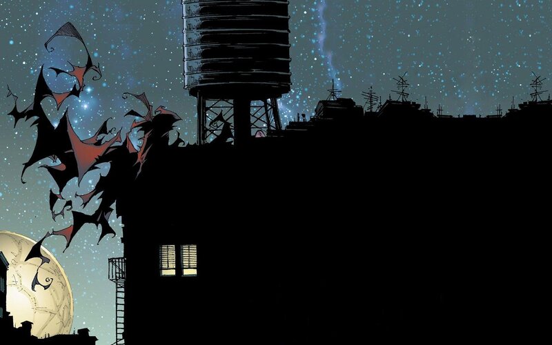 Batman silhouetted against night sky