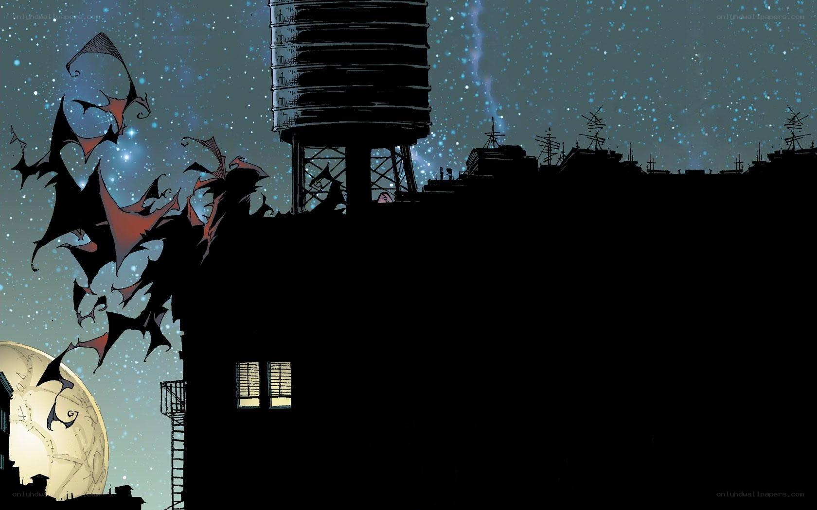 Batman silhouetted against night sky