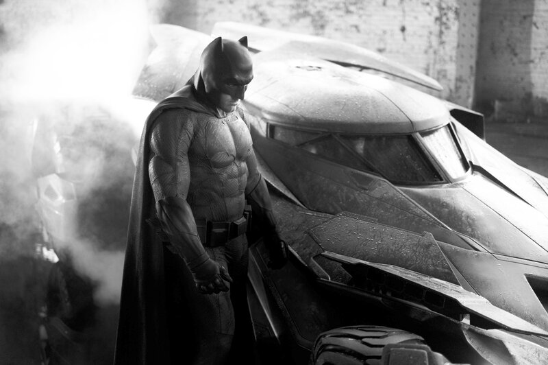 Batman Standing Beside Batmobile