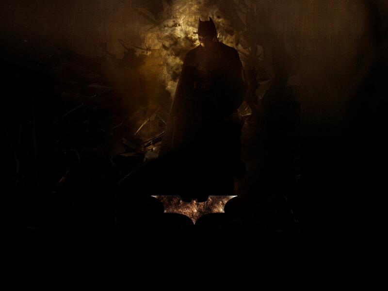Batman stands in rubble