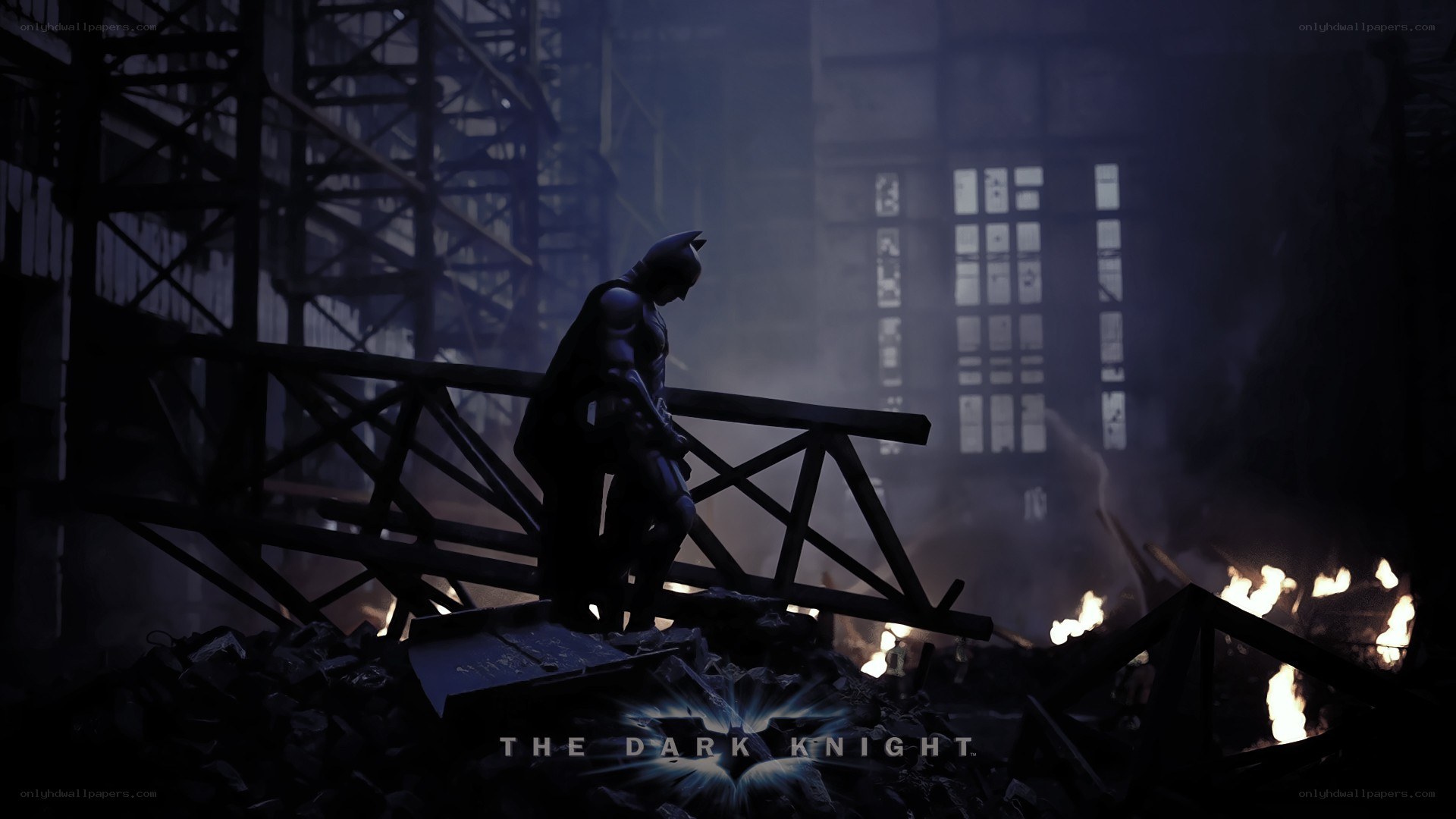 Batman stands in ruin