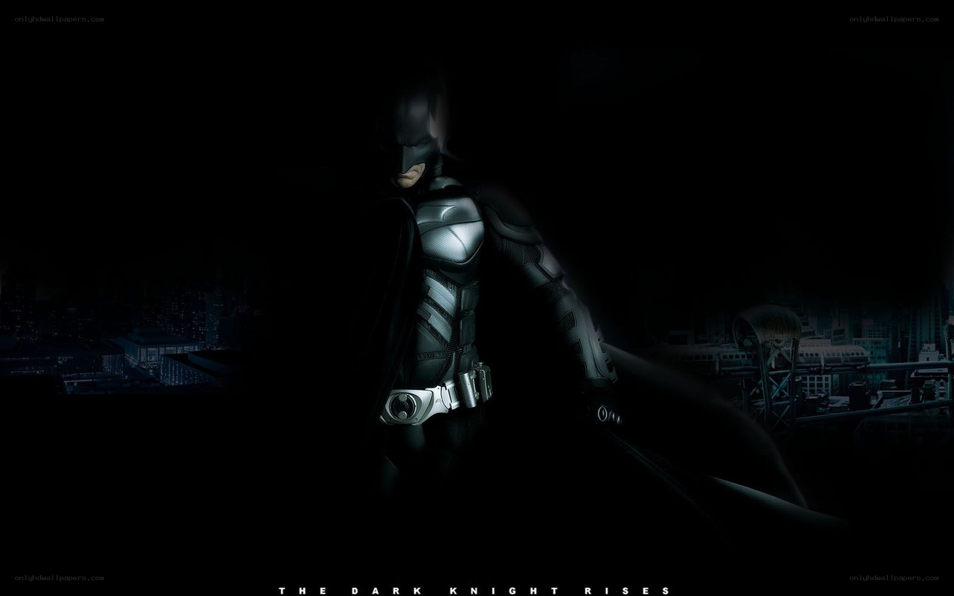 Batman stands in the dark