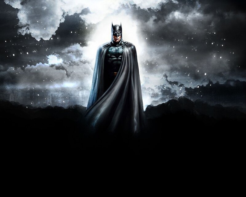 Batman stands in the night