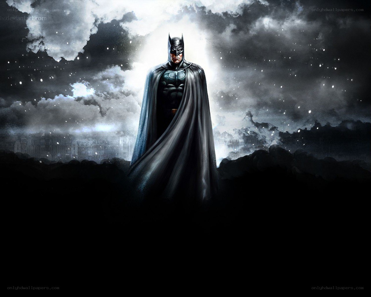Batman stands in the night