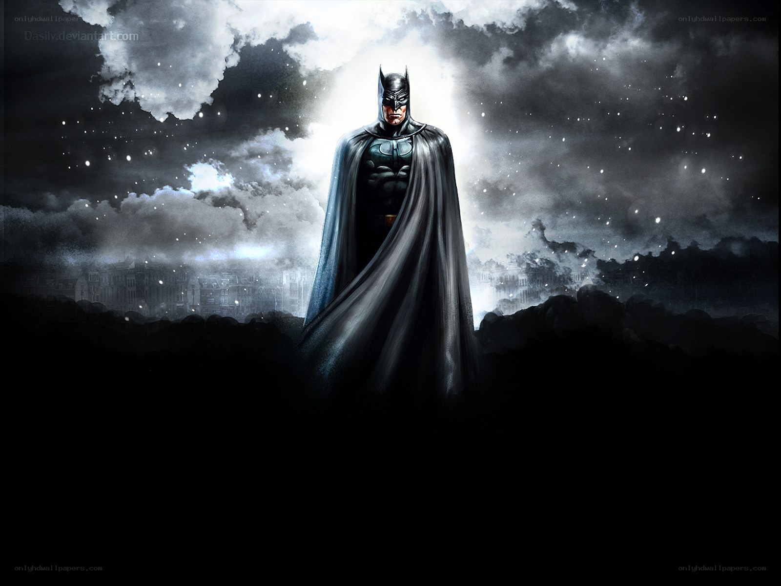 Batman stands in the night