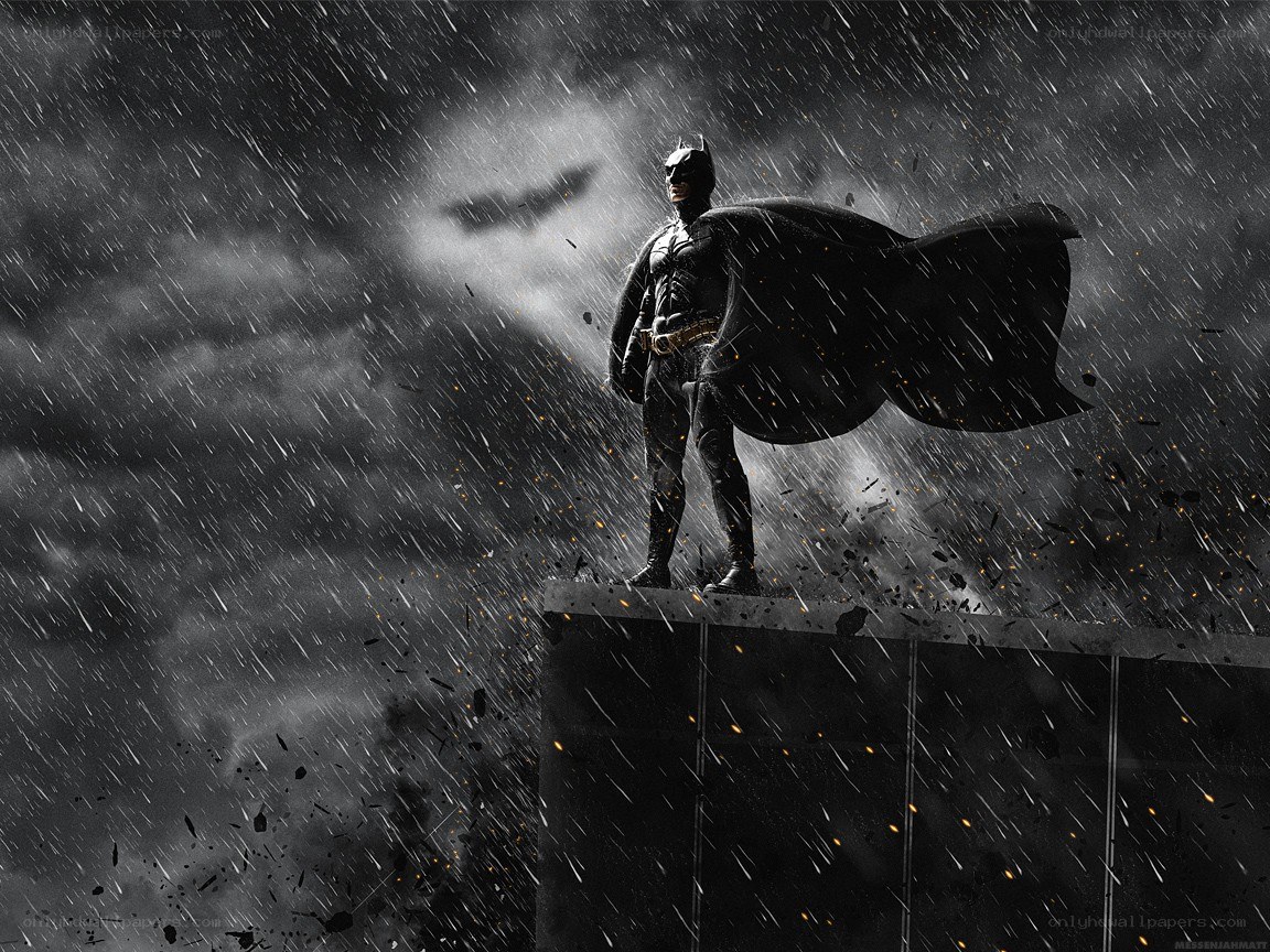 Batman stands in the rain
