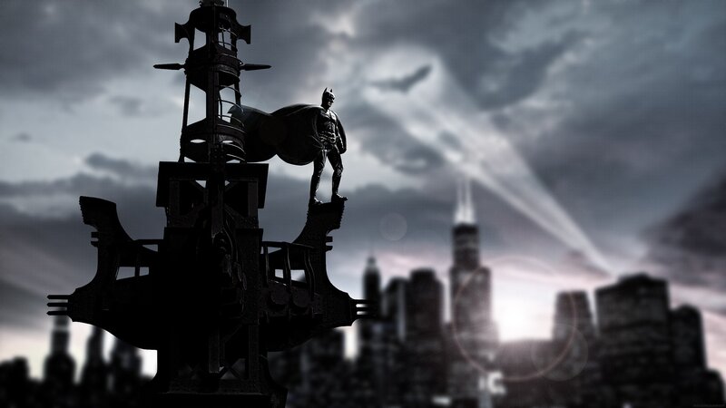 Batman stands on a tower