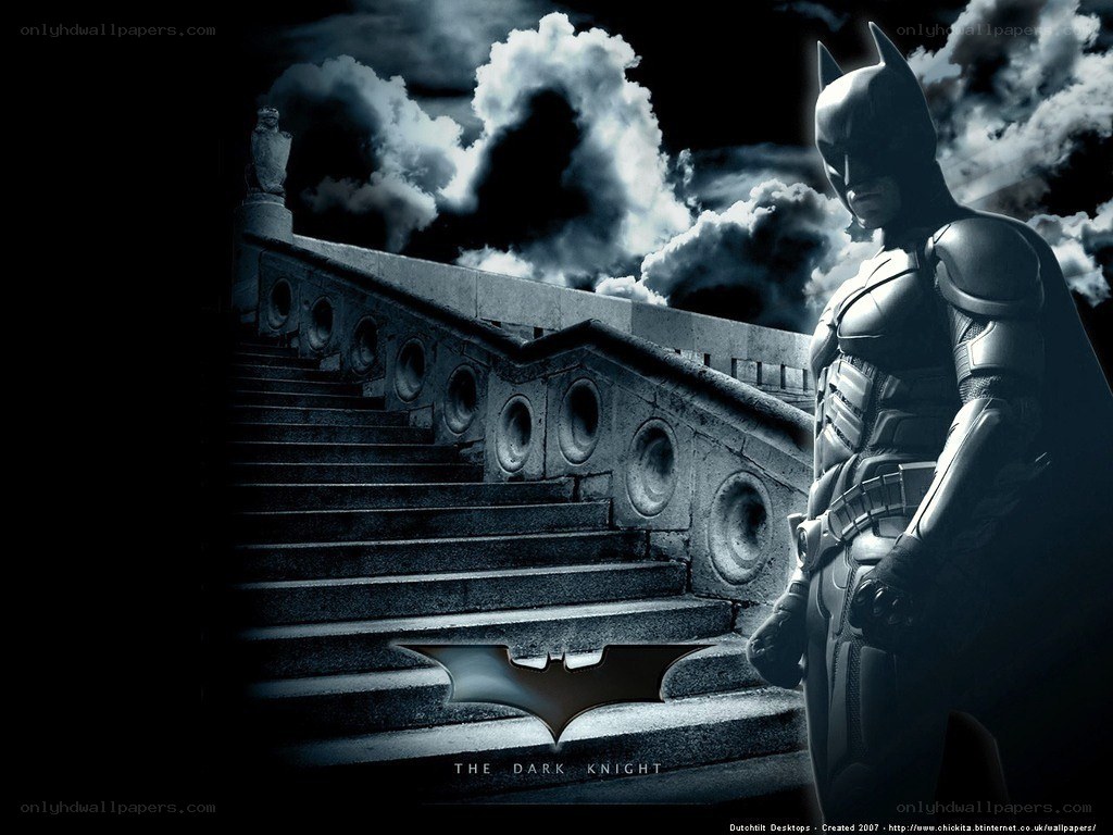 Batman stands on stairs
