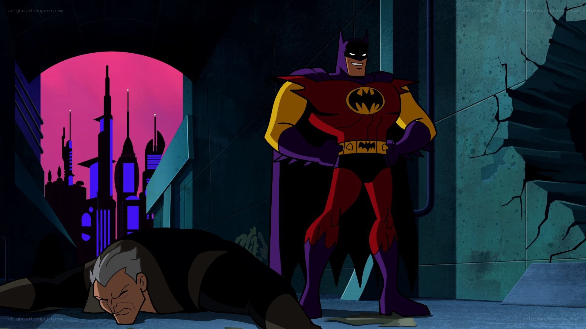 Batman stands over defeated foe
