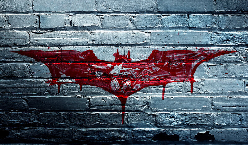Batman symbol on brick wall