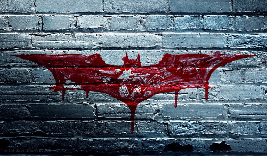 Batman symbol on brick wall