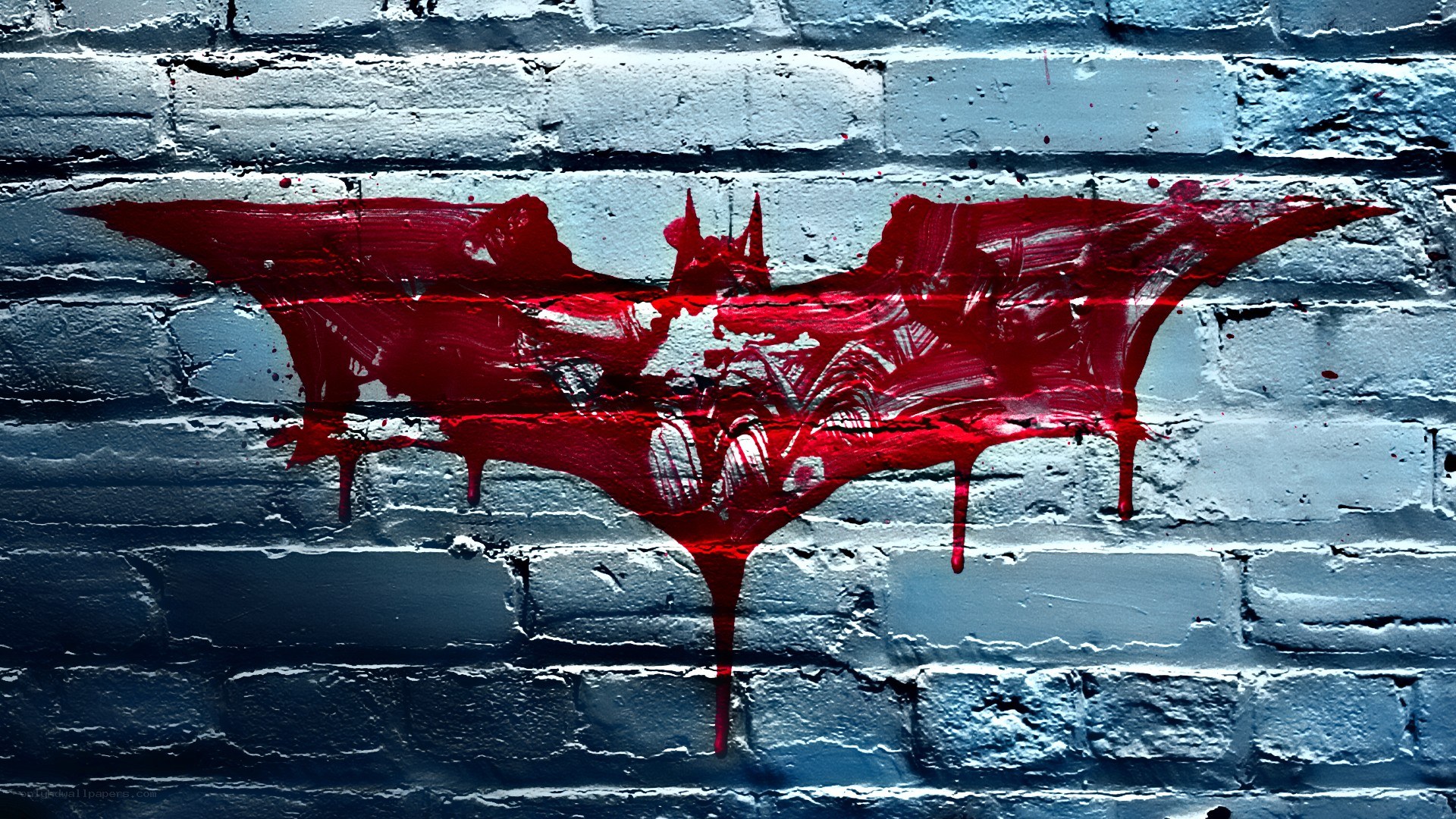 Batman symbol on brick wall