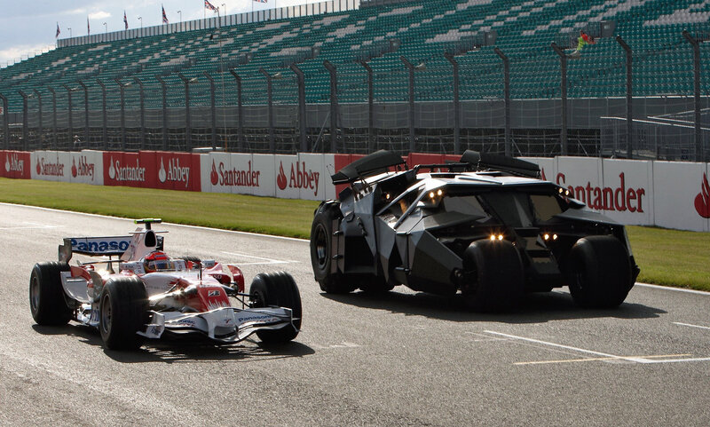 Batmobile and F1 car on track