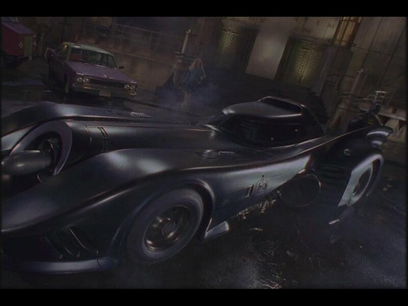 Batmobile in a dark garage
