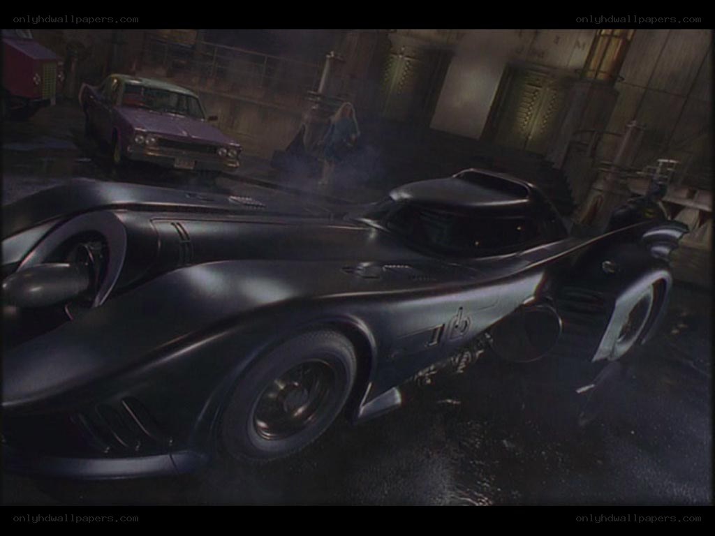 Batmobile in a dark garage