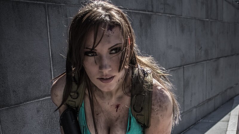 battle-worn woman in combat gear