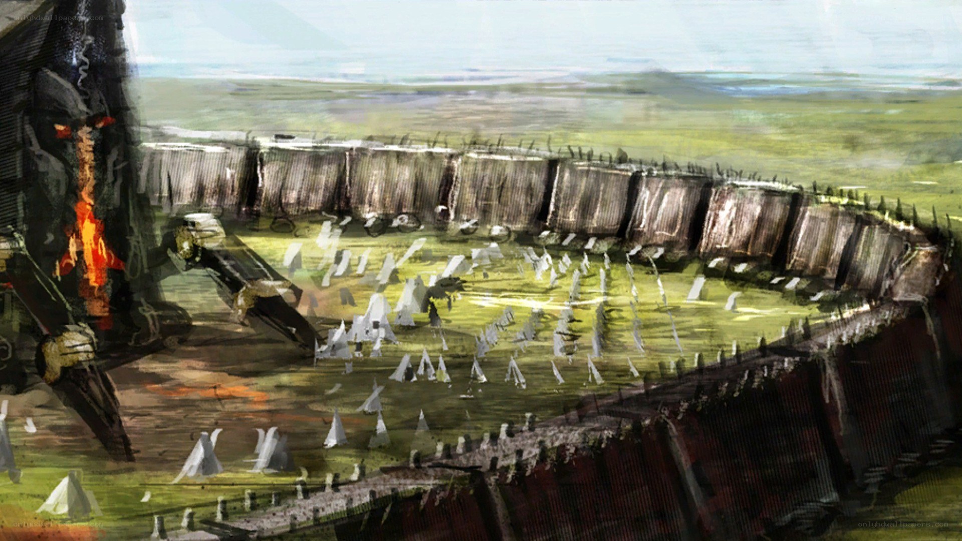 battlefield with burning wreckage
