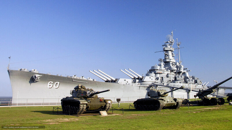 Battleship and tanks on display