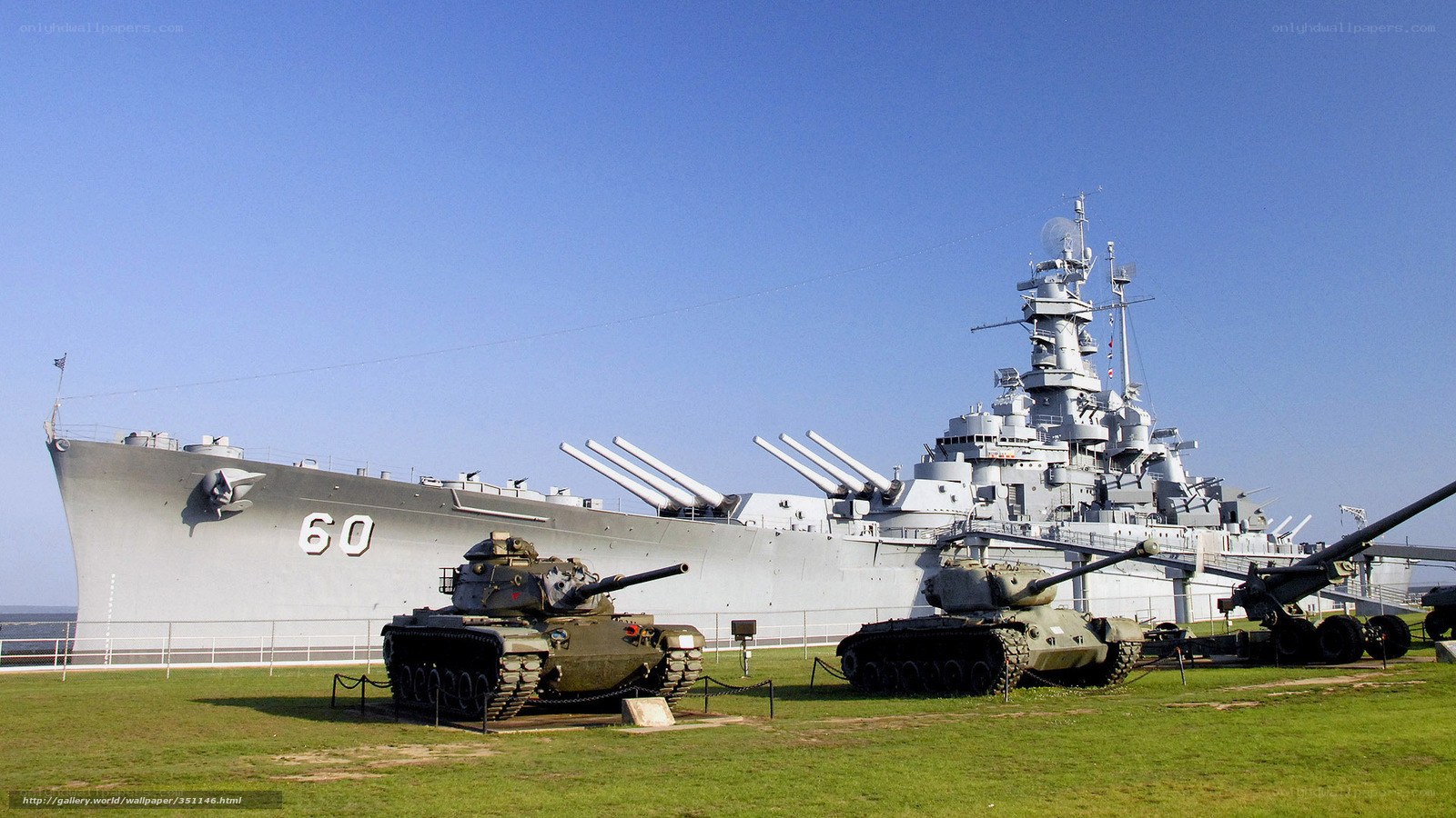 Battleship and tanks on display