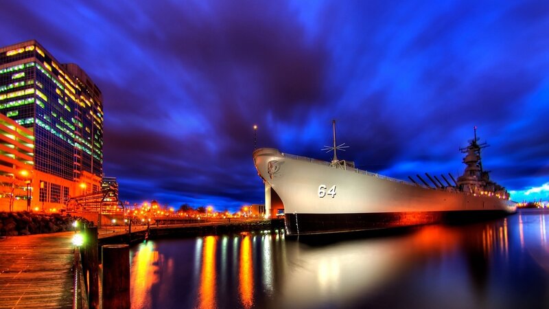 Battleship at night in port