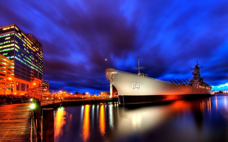 Battleship at night in port