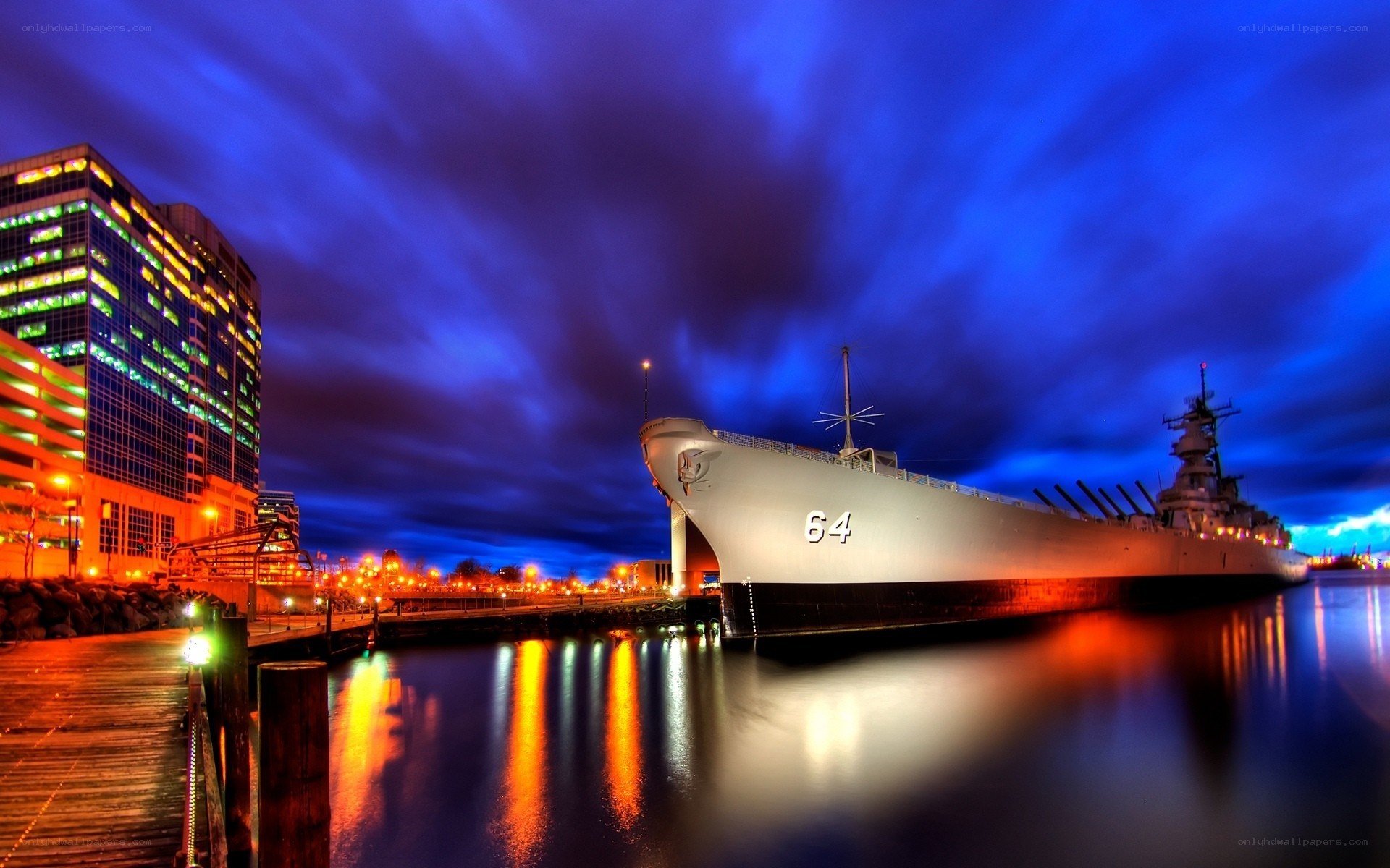 Battleship at night in port
