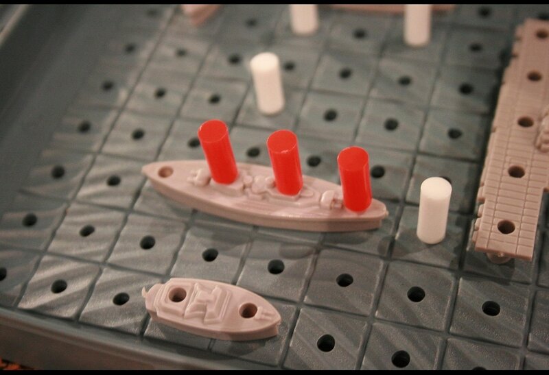 Battleship game with ships and pegs
