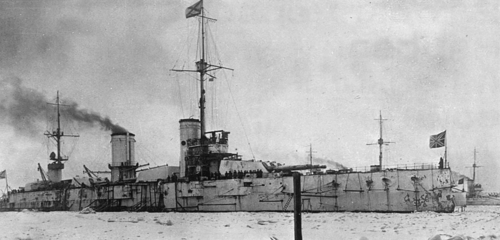 Battleship in snowy harbor
