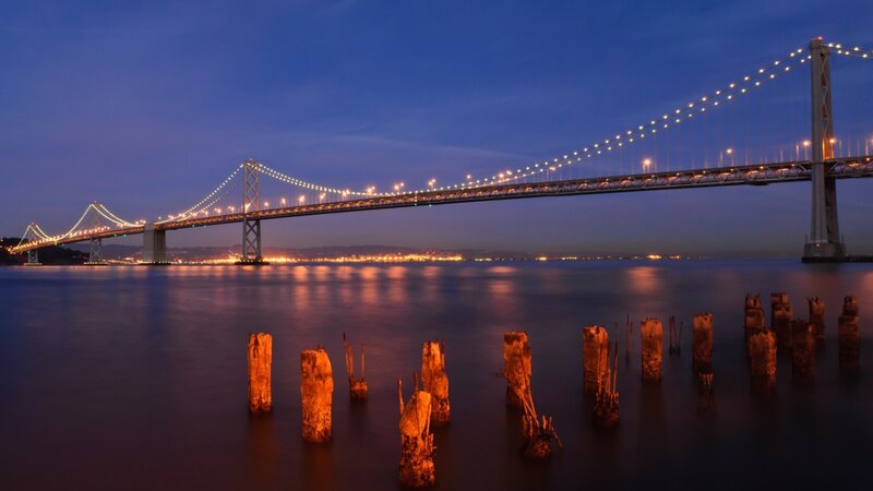 Bay Bridge at dusk with pilings