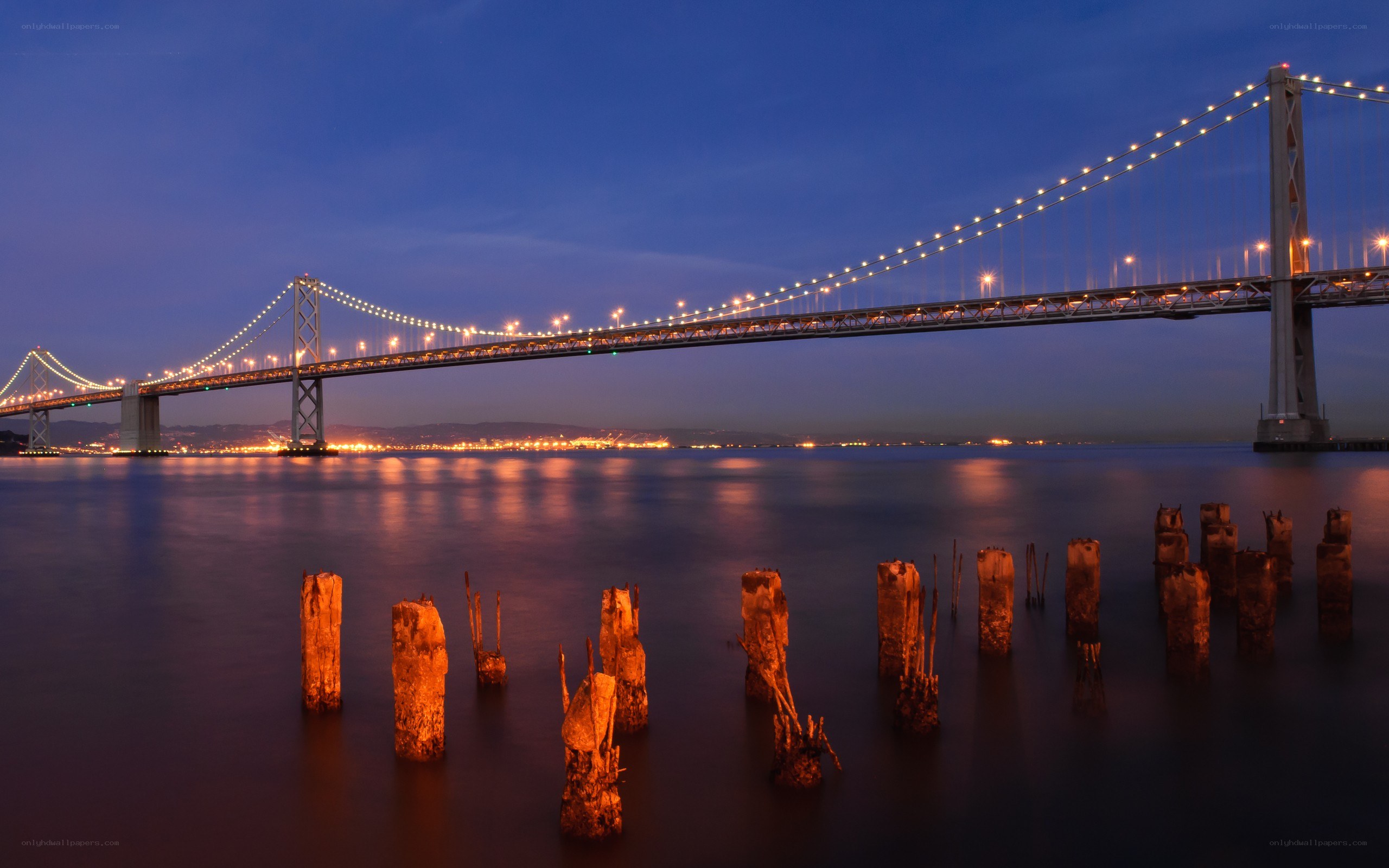 Bay Bridge at dusk with pilings