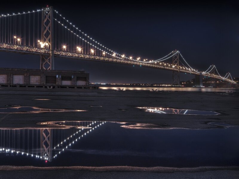 Bay Bridge at night with reflection